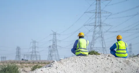 Two workers and power grids